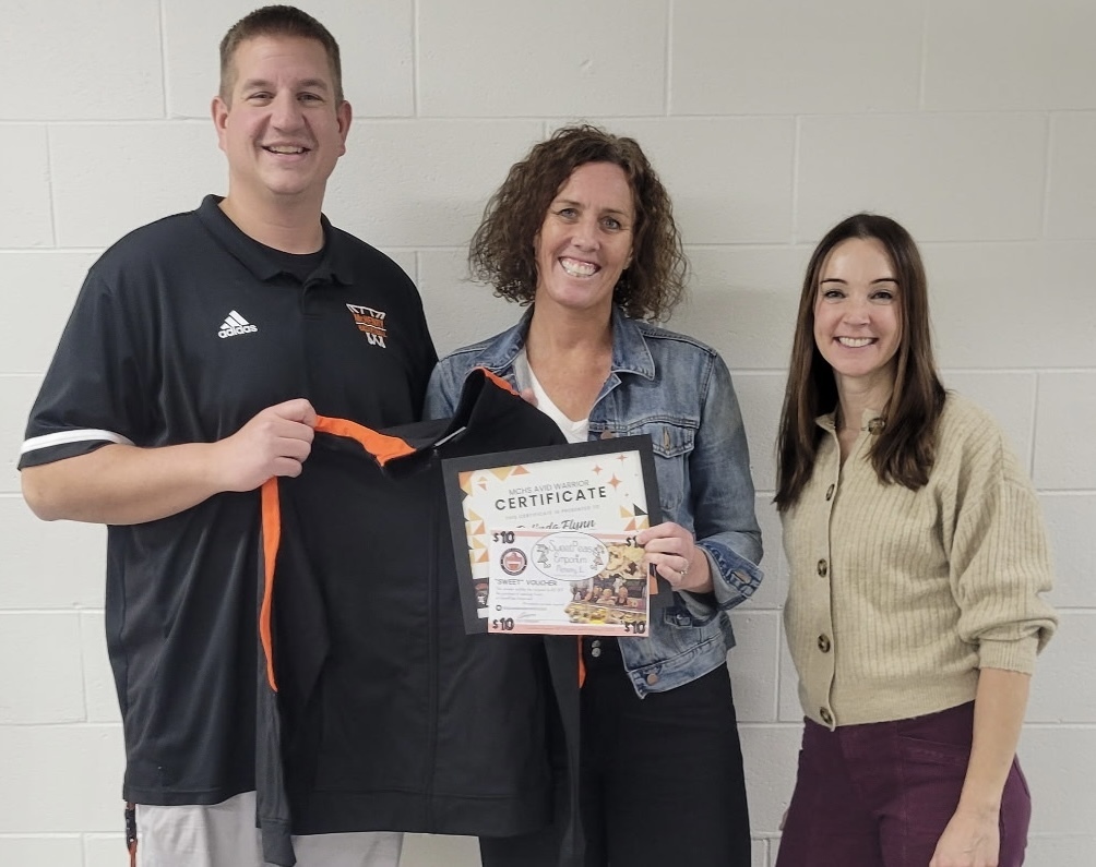 Belinda Flynn holding her certificate