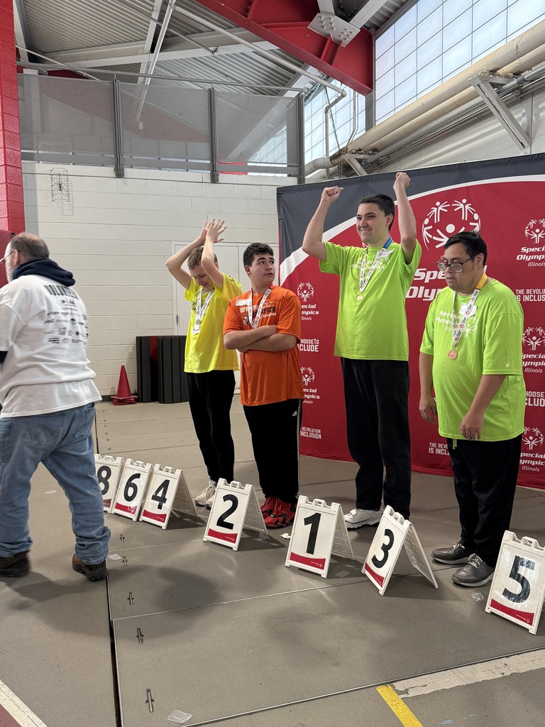 Student standing next to second place with other students