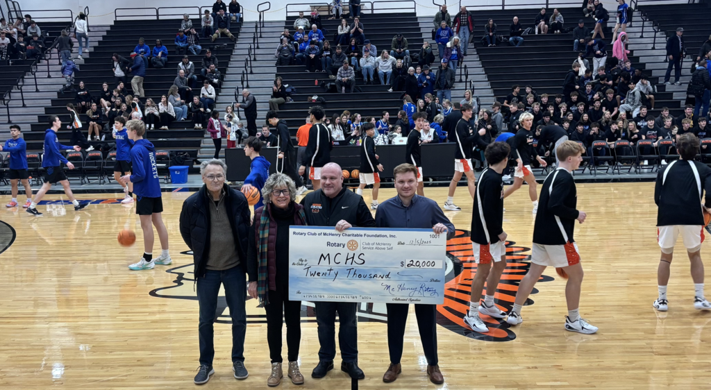 Three rotary representatives and District 156 superintendent with check of 20,000