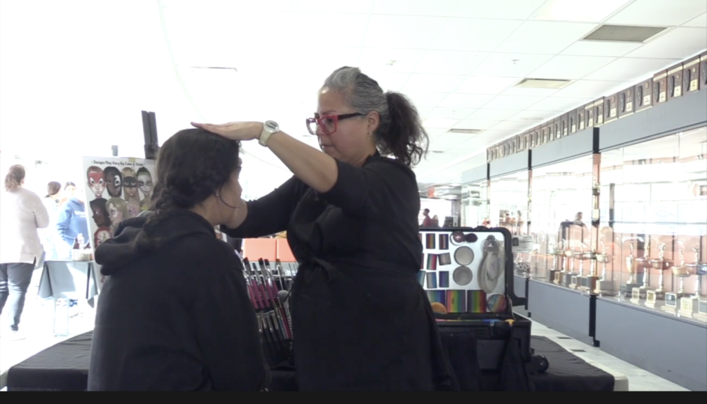 Student getting face painted