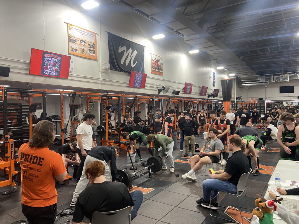 Strength room with lots of people in it 