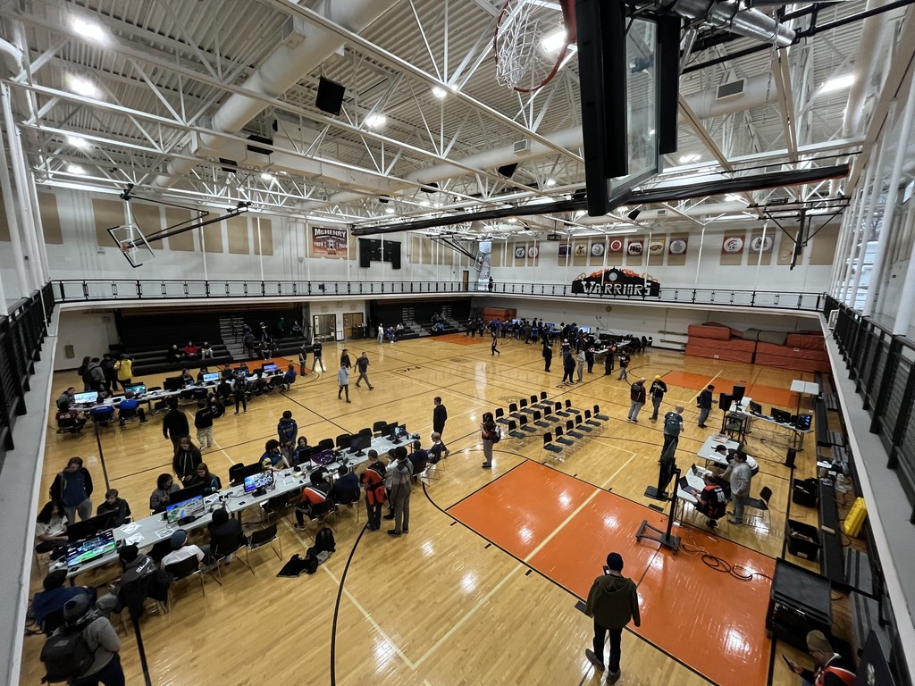 An overhead shot of people playing on computers in the gym 