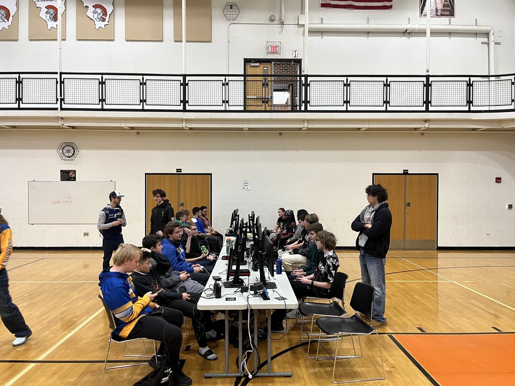 Students playing at a table of computers