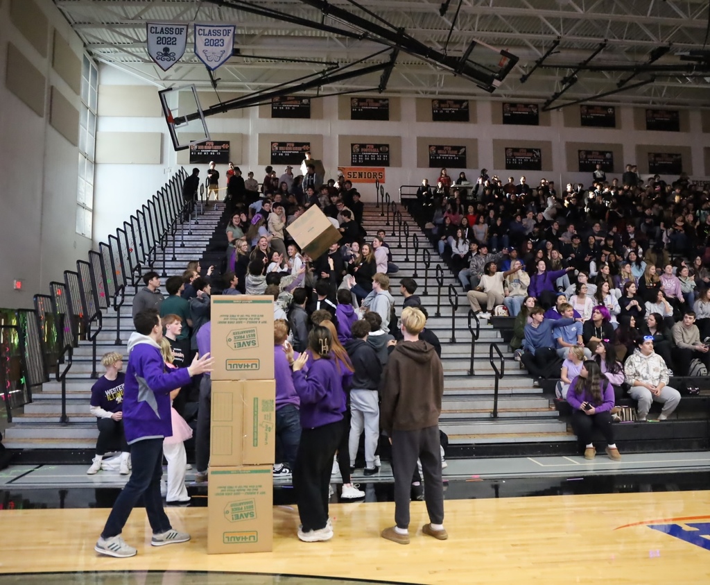 Students stacking boxes 