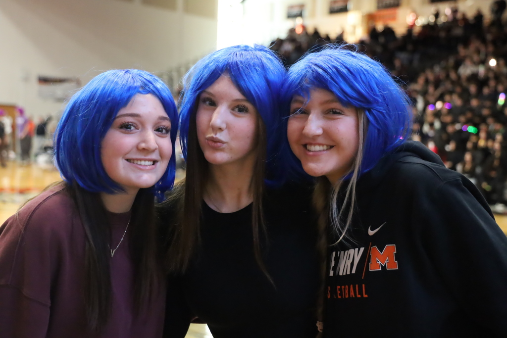 Three students with blue wigs 