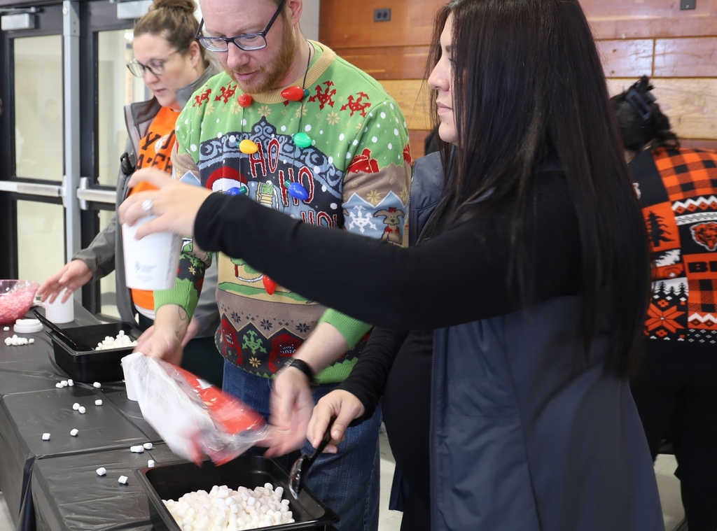 Counselors serving hot chocolate 