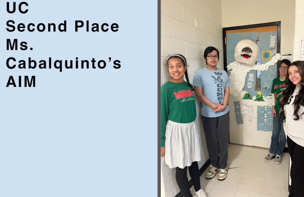 Upper Campus Second Place Ms. Cabalquint's AIM Students by door with the Abominable Snowman