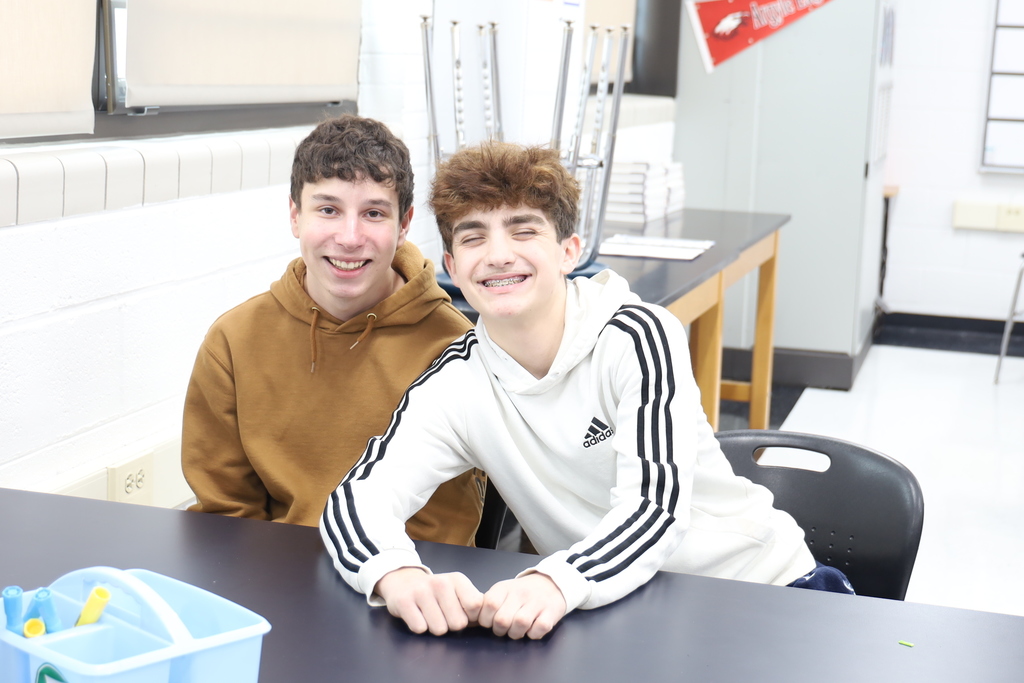 Two students at a table 