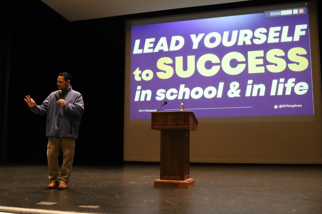 Ovi speaking with "lead yourself to success in school and in life" in the background