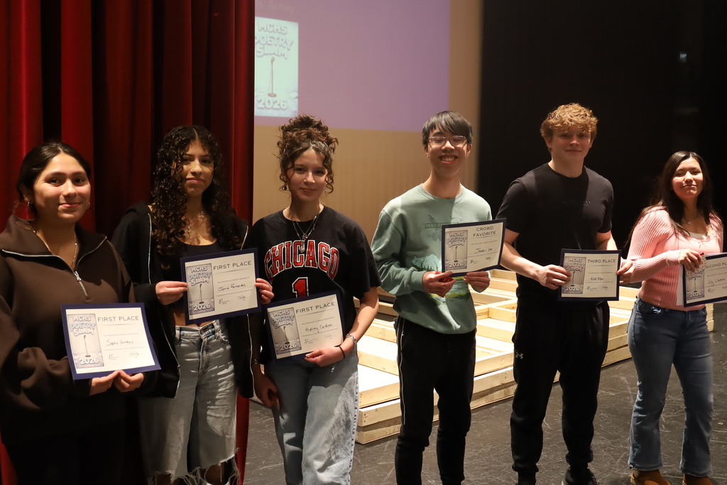 Students holding certificates