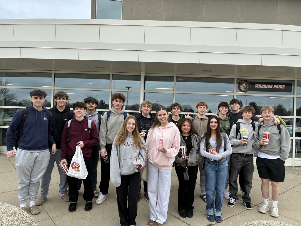 Group of students standing outside the school