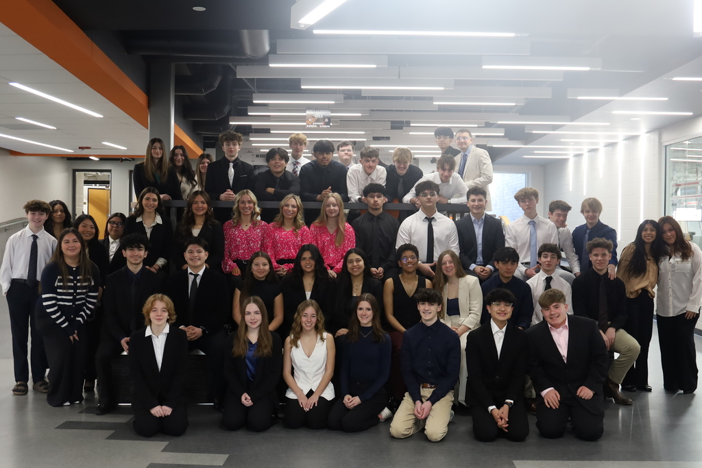 Group of BPA students dressed in business clothes posed together 