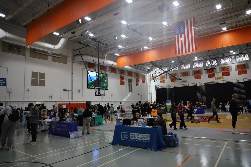 Gym with the fair and vendors at booths