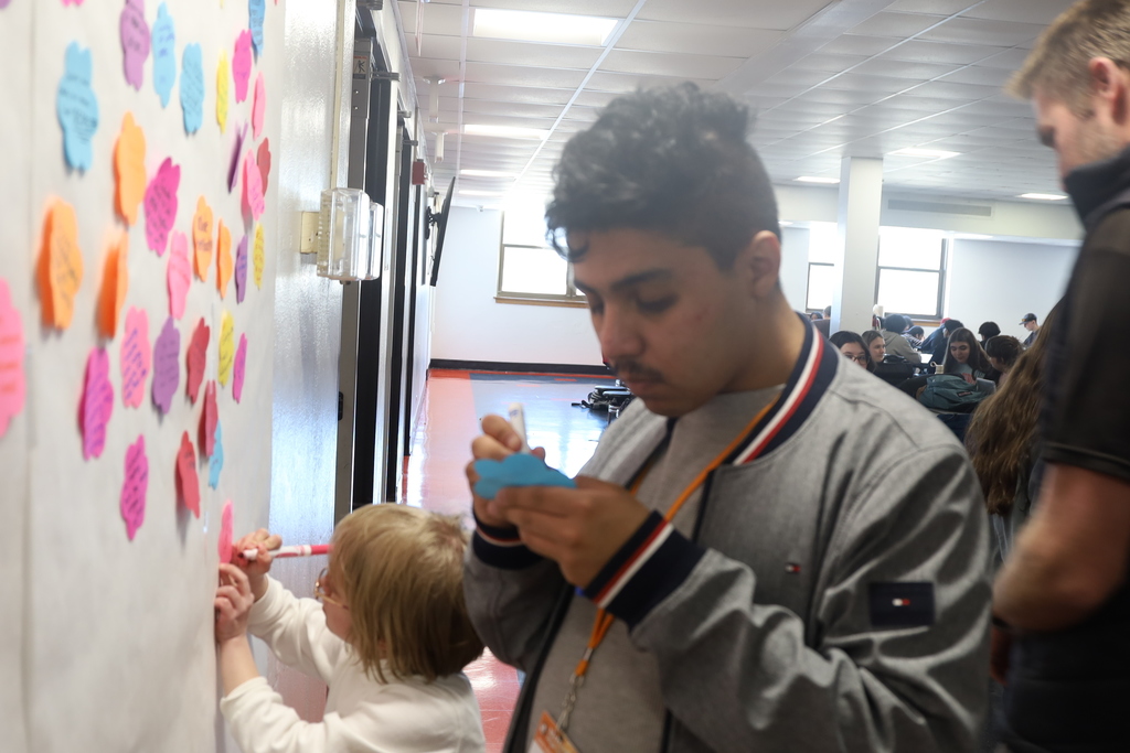 Students writing what inclusion means to them