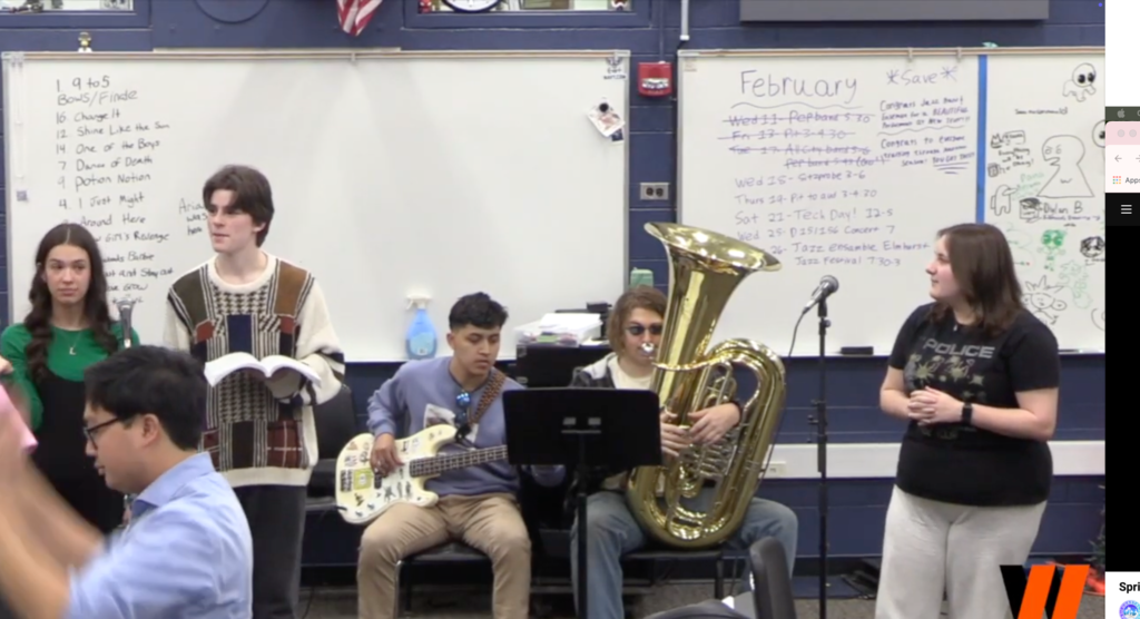 Students practicing singing with instruments for the musical 