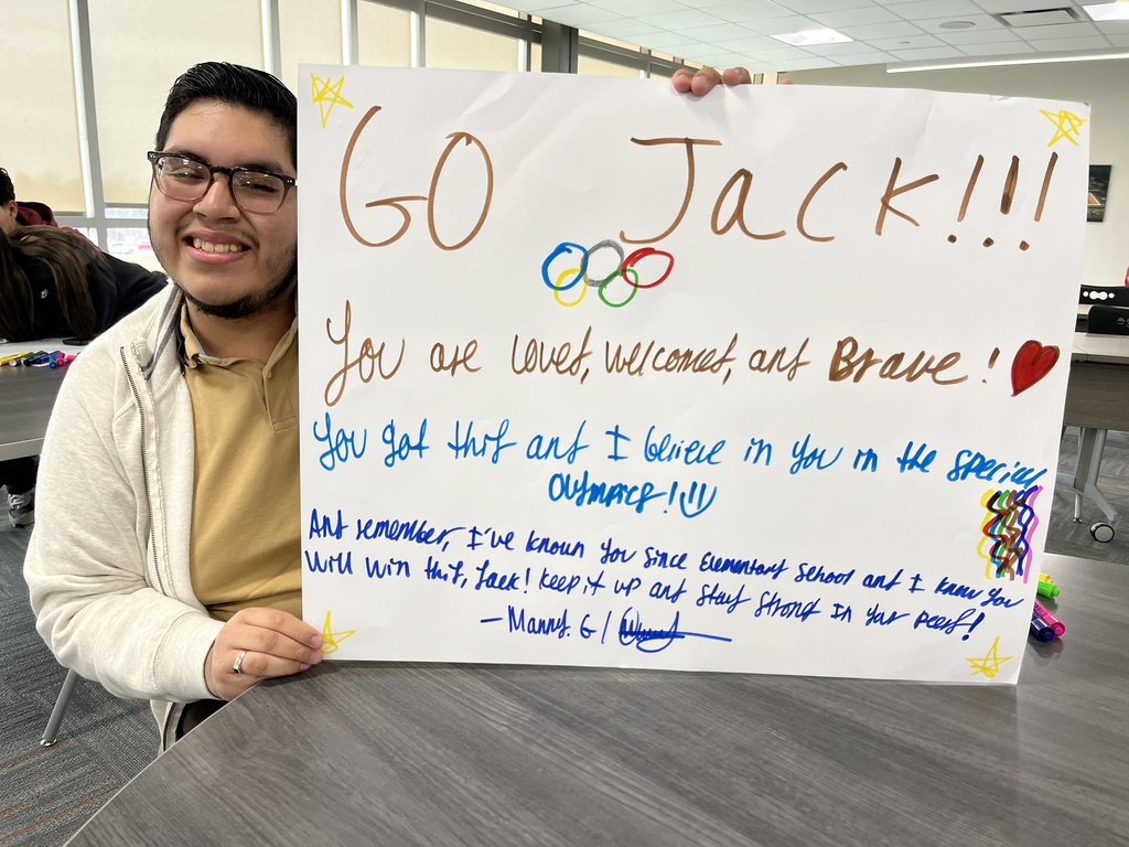 Student holding up his poster that says Go Jack! You are loved, welcomed and brave You got this and I believe in you in the Special Olympics! And remember I've known since elementary school and I know you will win this, Jack! Keep it up and stay strong!