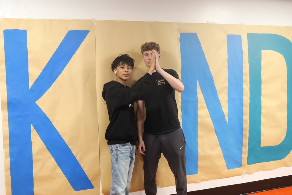 Two students hiving as the eye in kind 