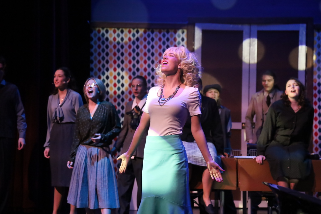 Student singing with background singing 