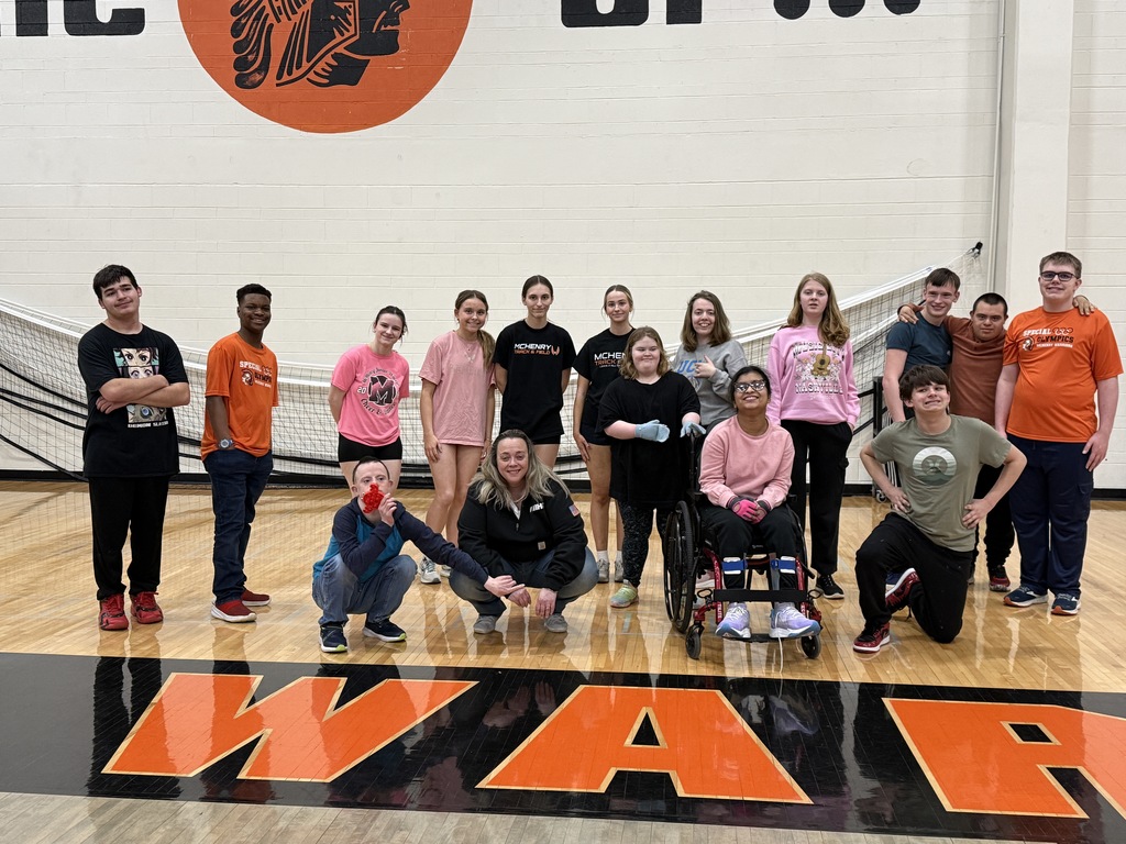 Photo of girls track team members who helped coach Special Olympics athletes