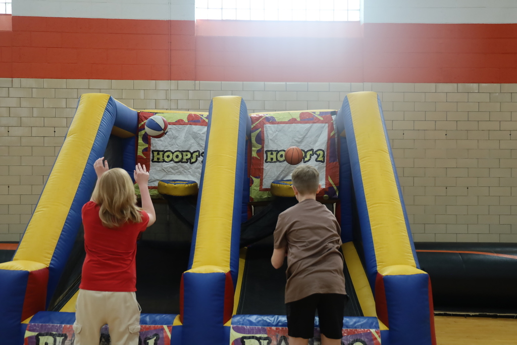 Students playing with a hoops carnival-style game