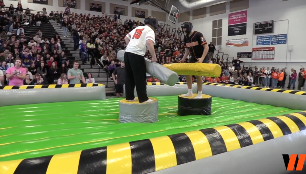 Students on an inflatable jousting