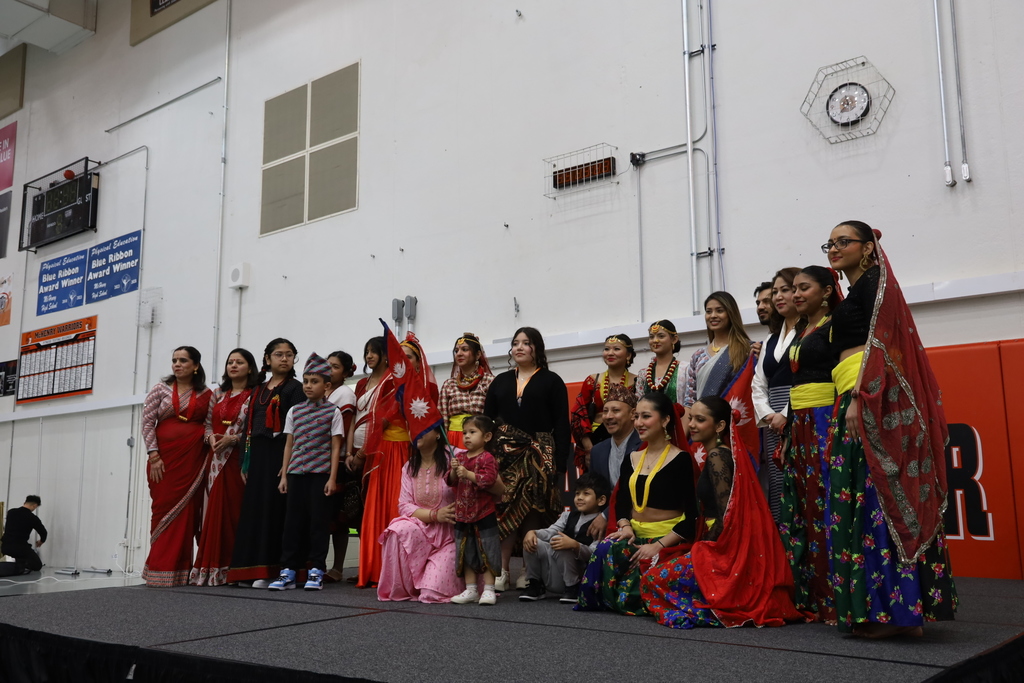 A group in cultural attire posing