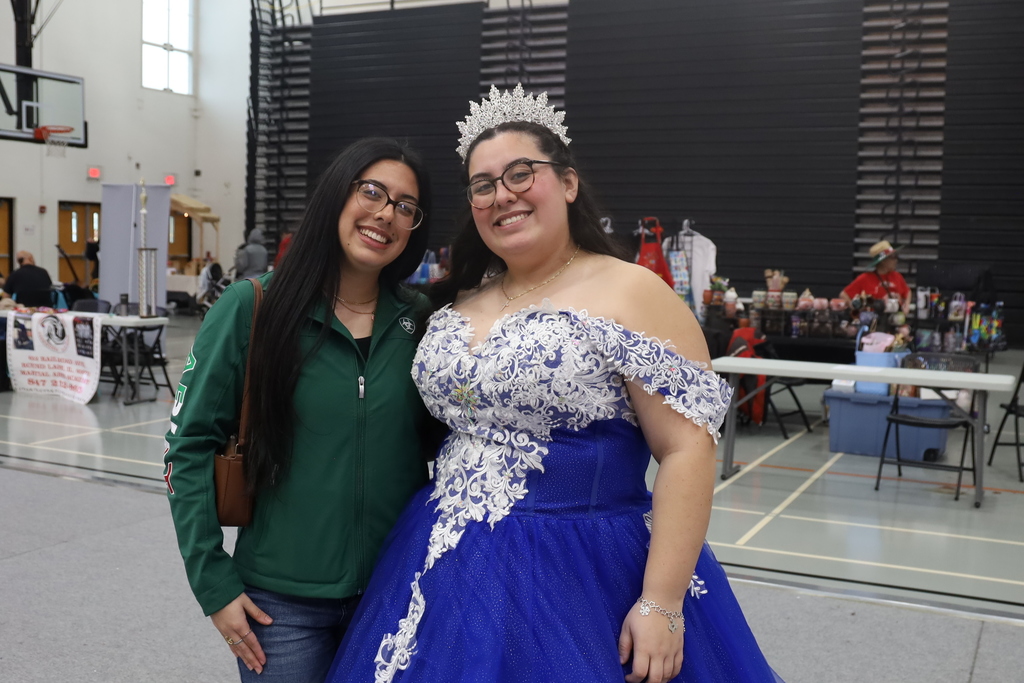 Girl in Quincenera dress with sister