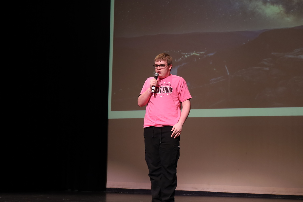 Student singing on stage 