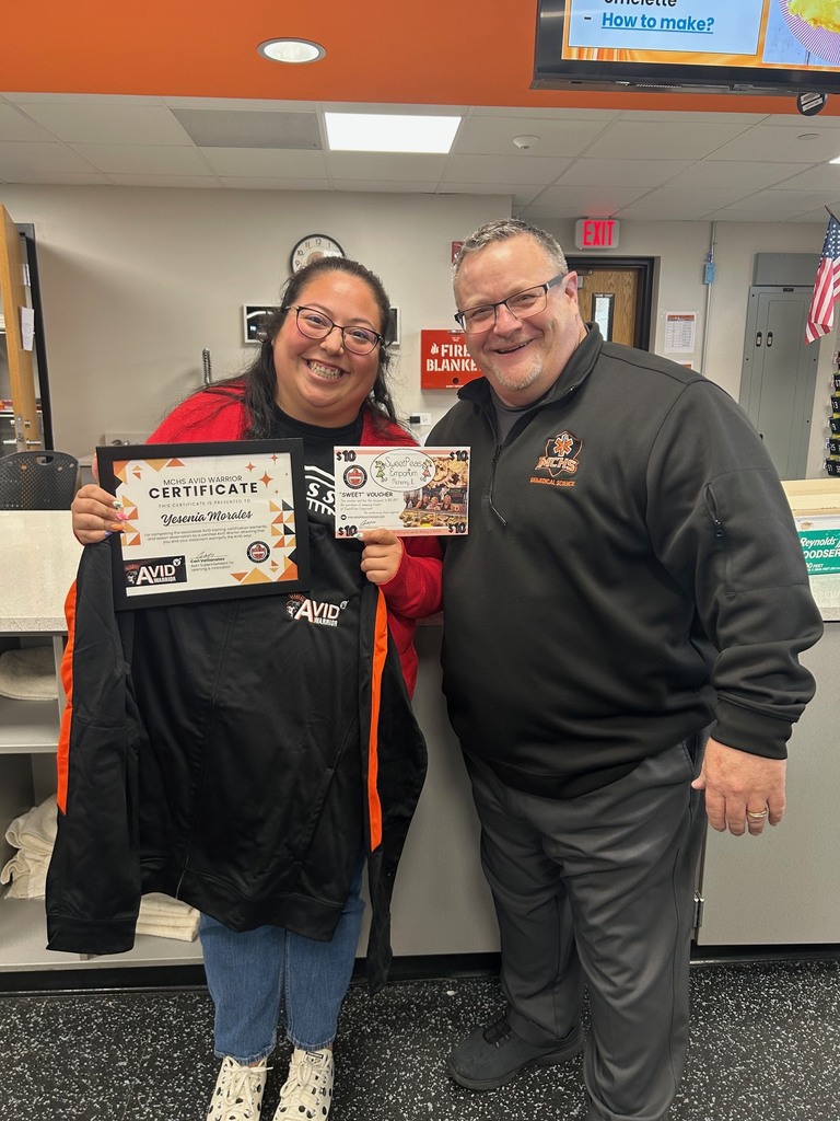 Yesenia Morales holding AVID certificate and jacket next to Carl Vallianatos
