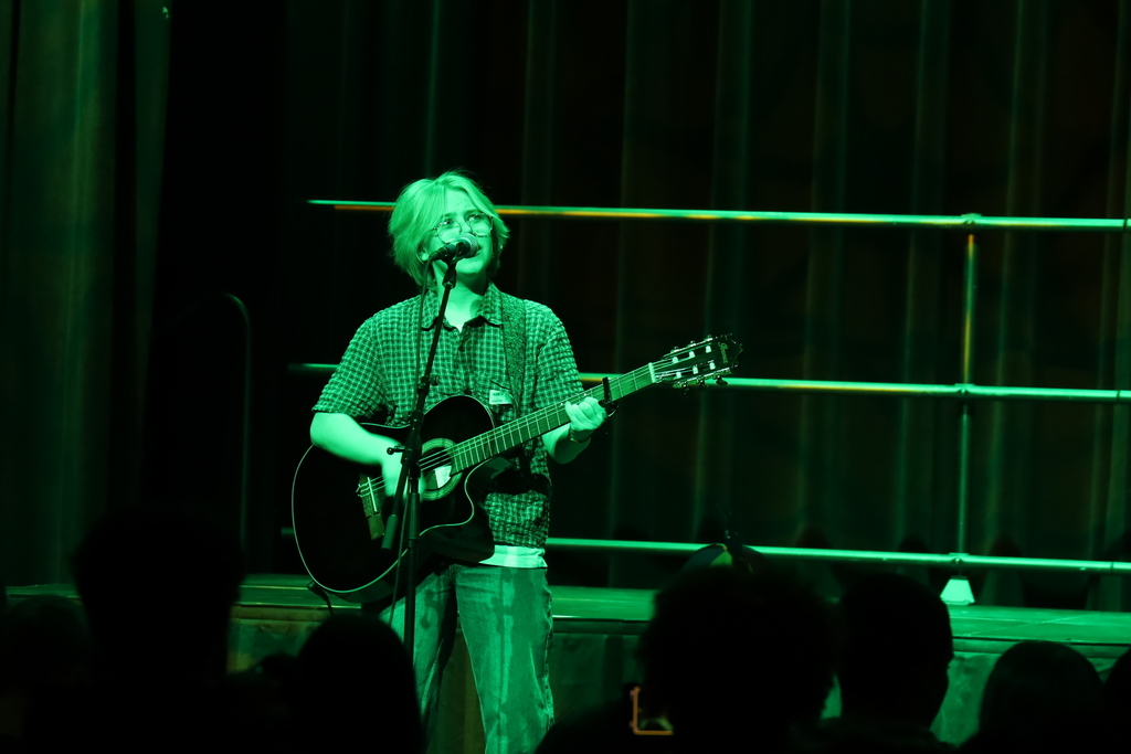 Student singing with guitar