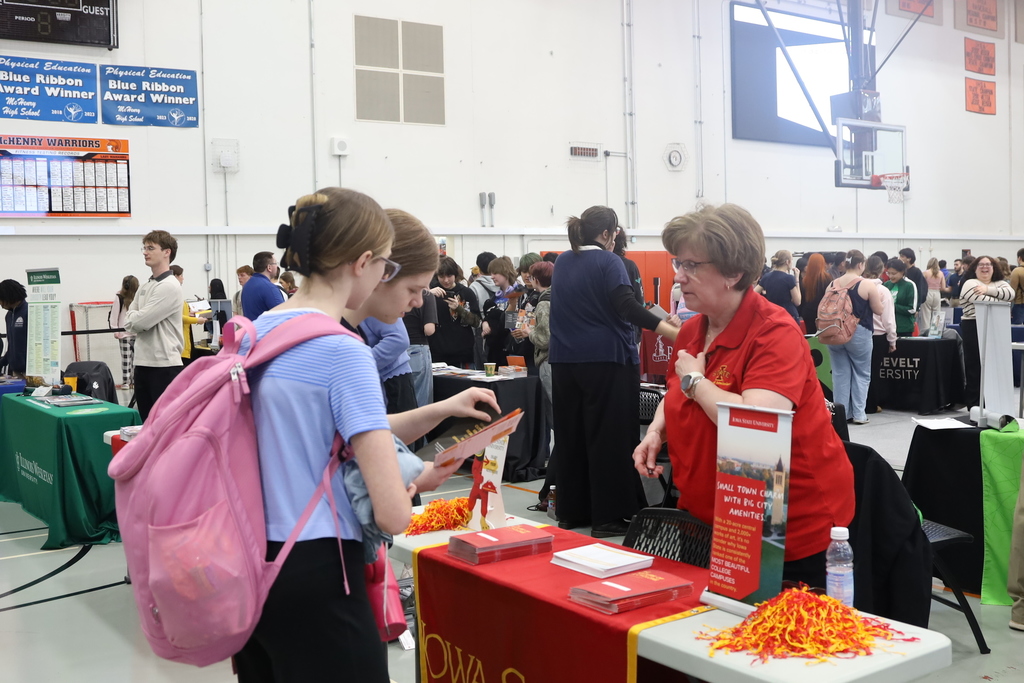 Students talking to a representative 