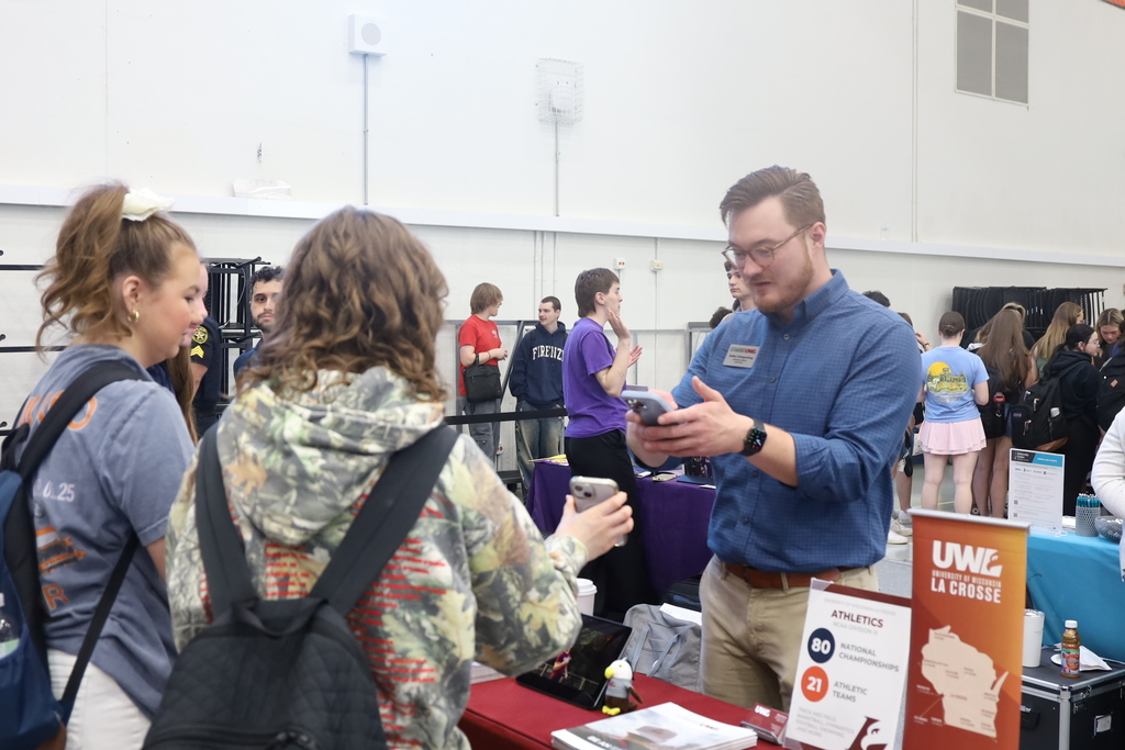 Students talking to a representative 