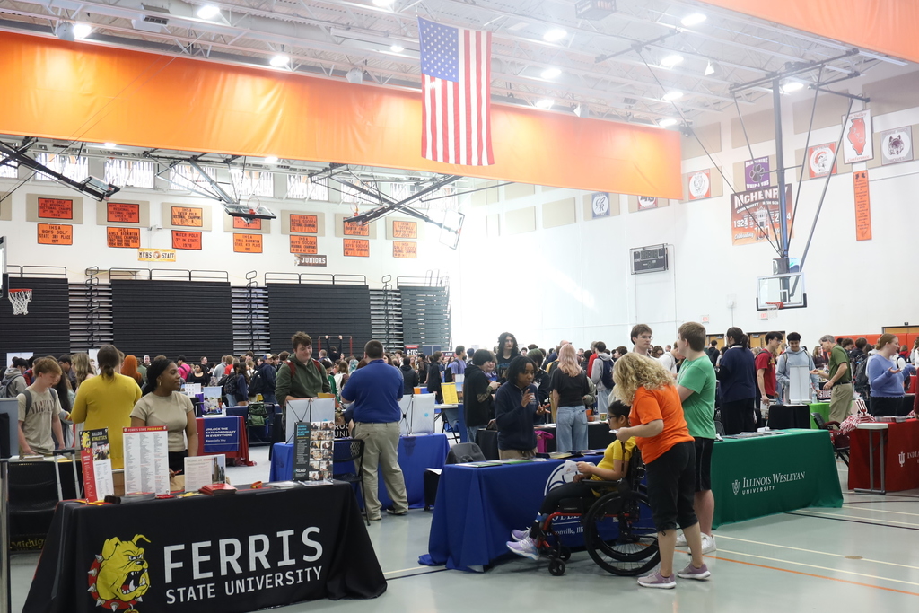 Gym filled with students and representatives with their tables