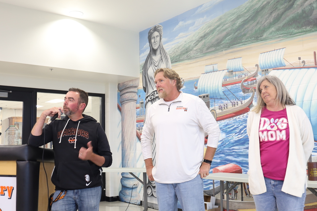 Ryan Ellison speaking to Ray Currie. Kim Fatih standing next to Ray.