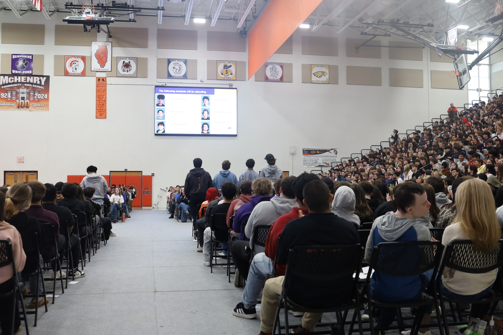 People sitting with some students standing