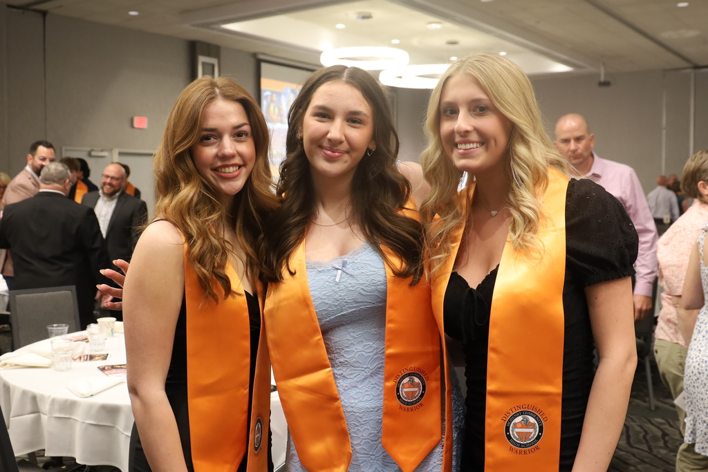 Three students in stoles