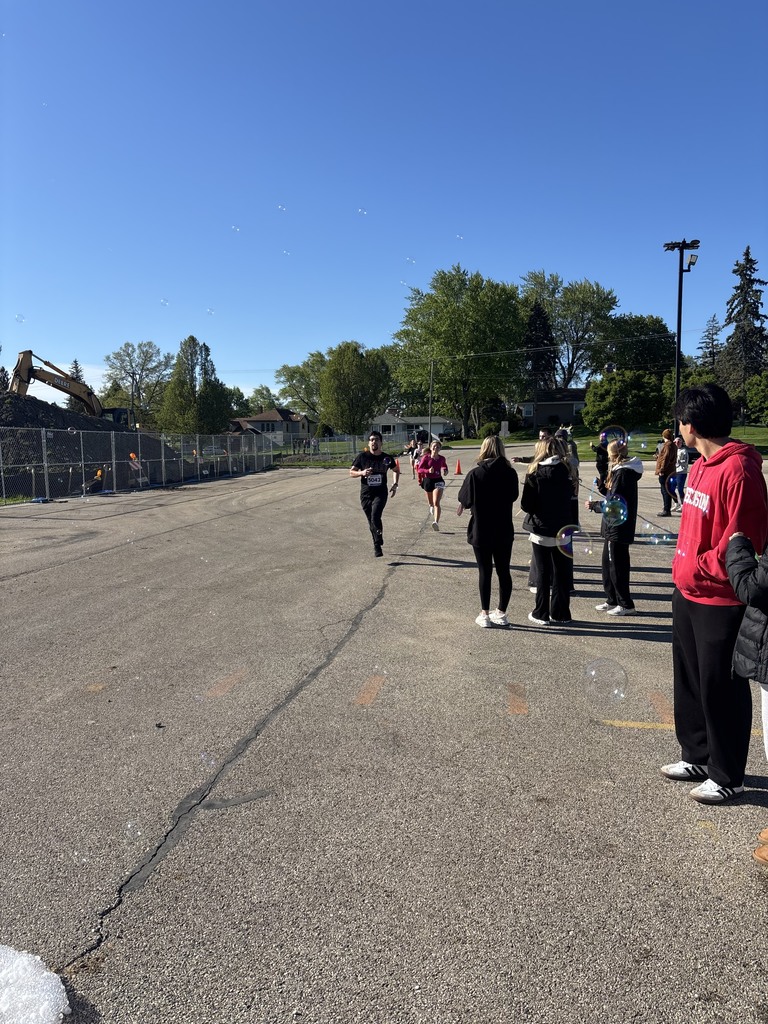 People racing with others watching