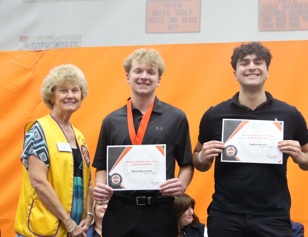 Two students with representative for the Lions Club Scholaraship