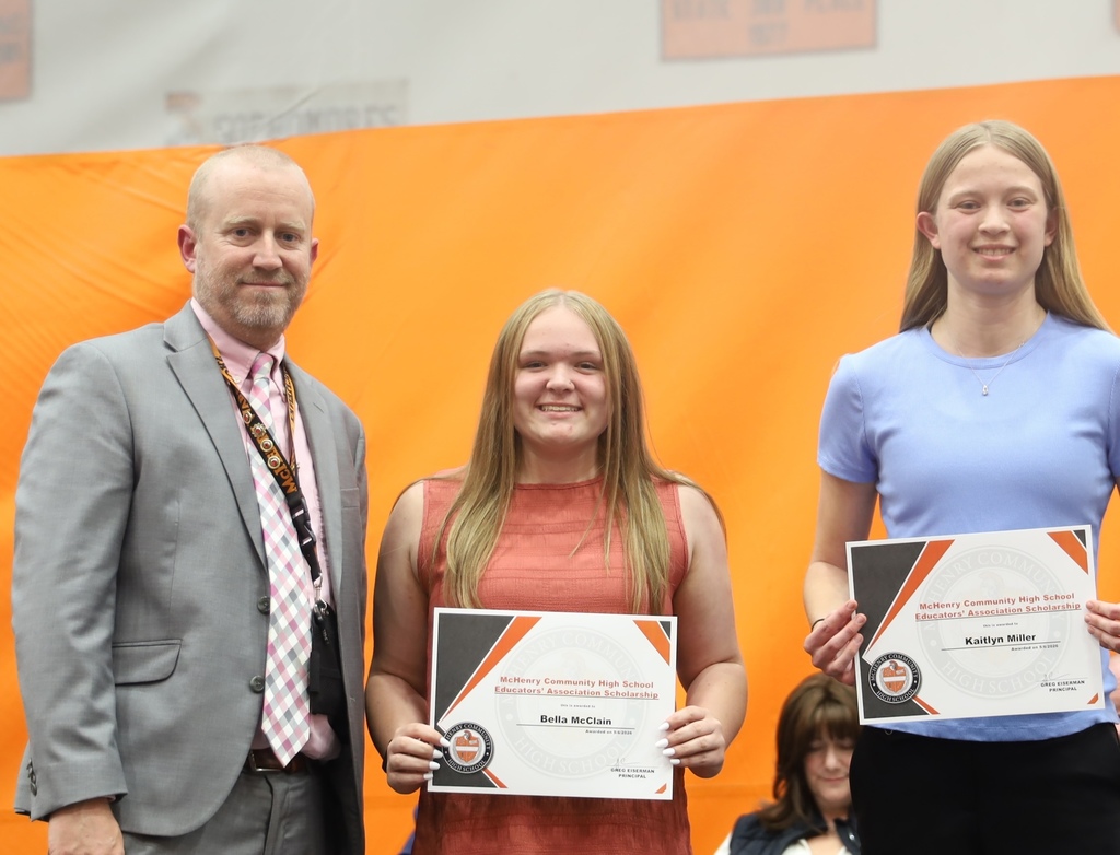 Two students with principal for the McHenry High School Educator's Association scholarship