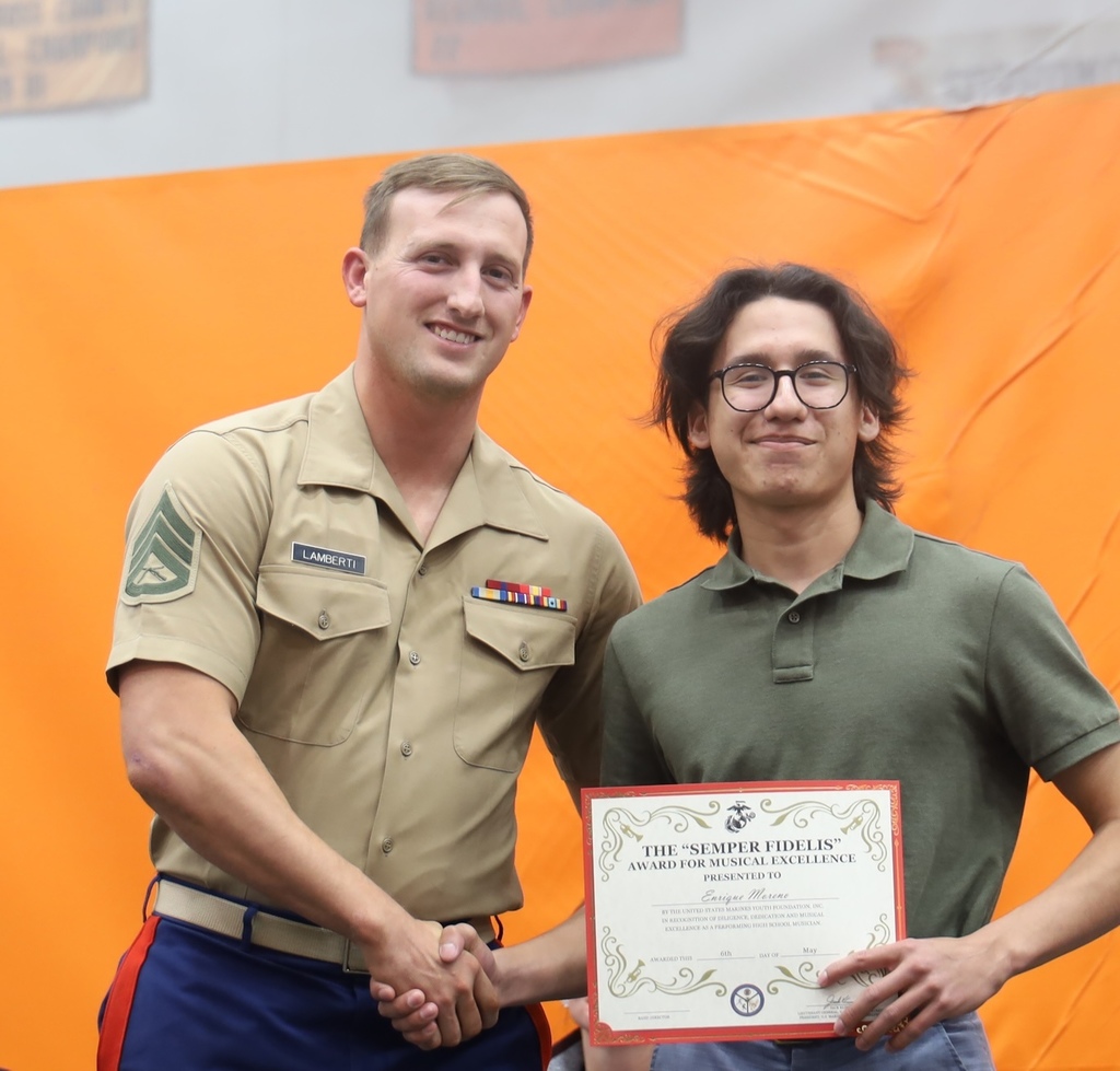 Student with Marine for the Semper Fidelis Award for Musical Excellence
