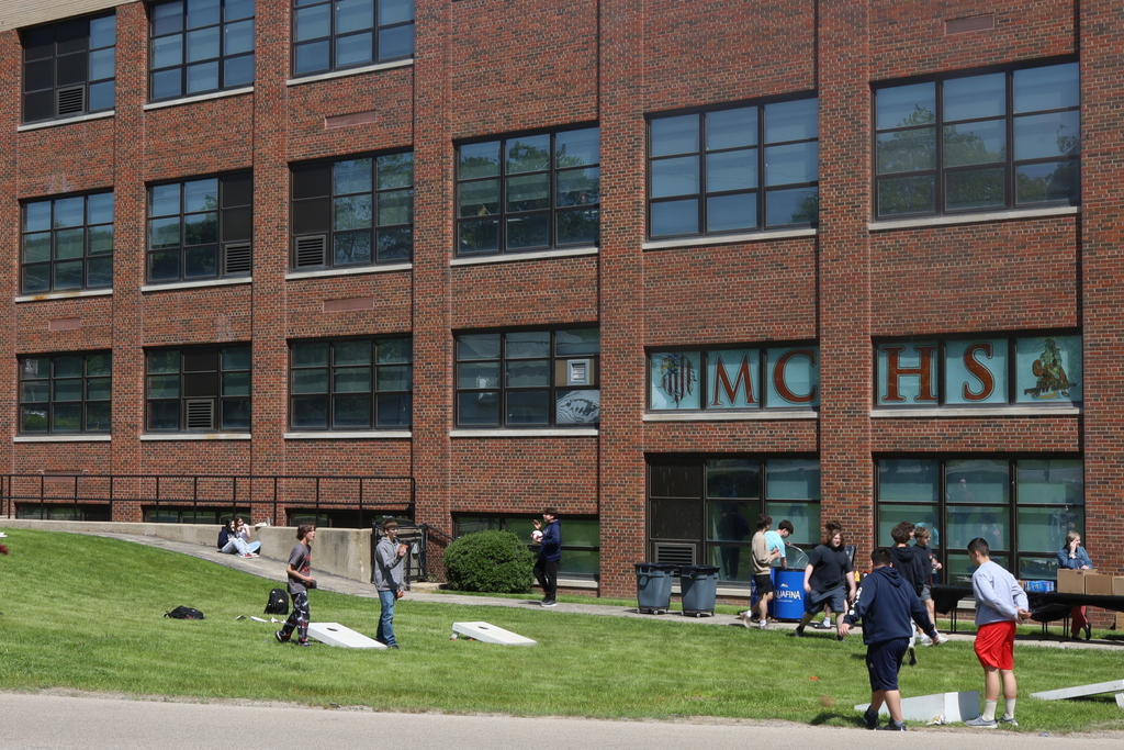 Students playing bags outside of Freshman Campus 