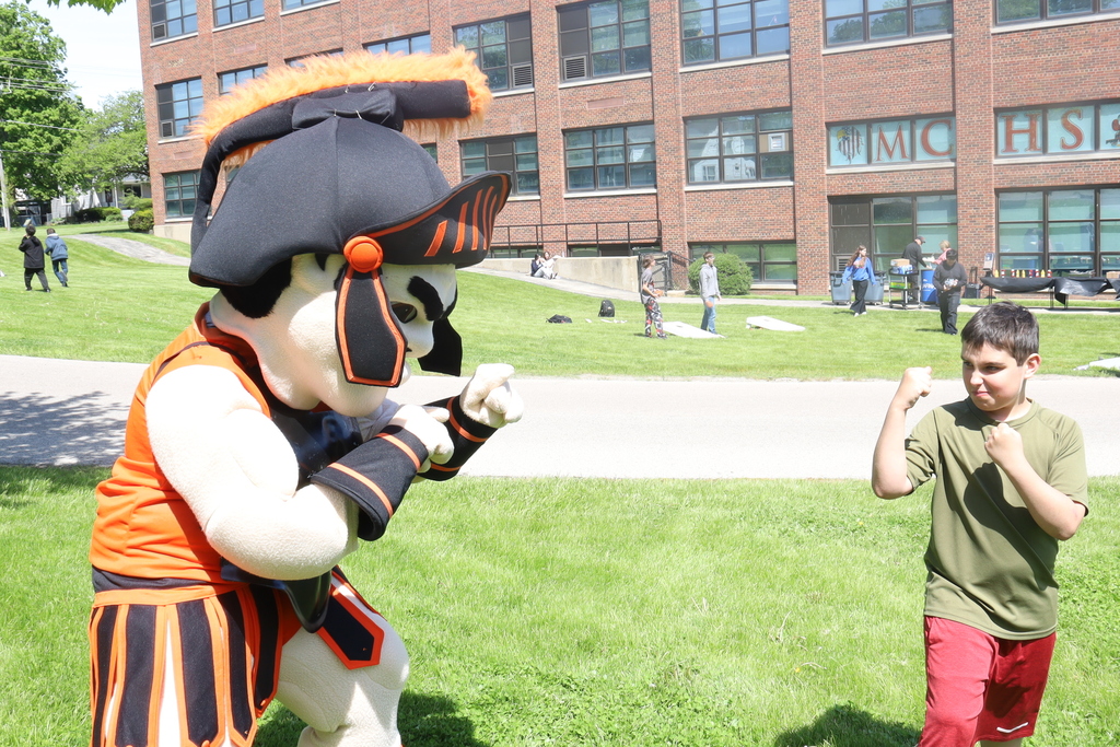 Student and Leonidas holding up fists to each other 