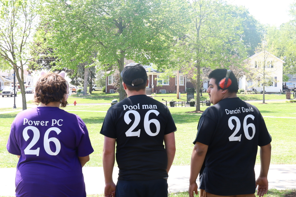 Bridges students with 26 on the back of their shirts with "Power PC" on one "Pool Man" on one and "Dancin' Davis" on another