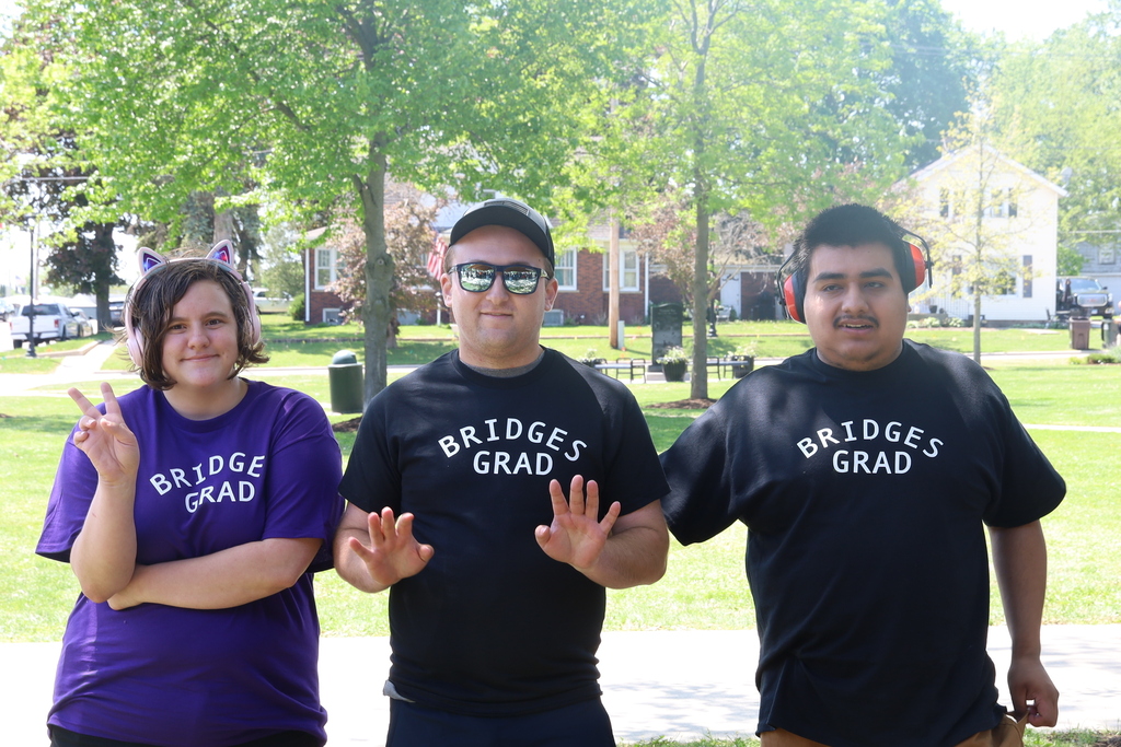 Three students in Bridge Grad shirts 