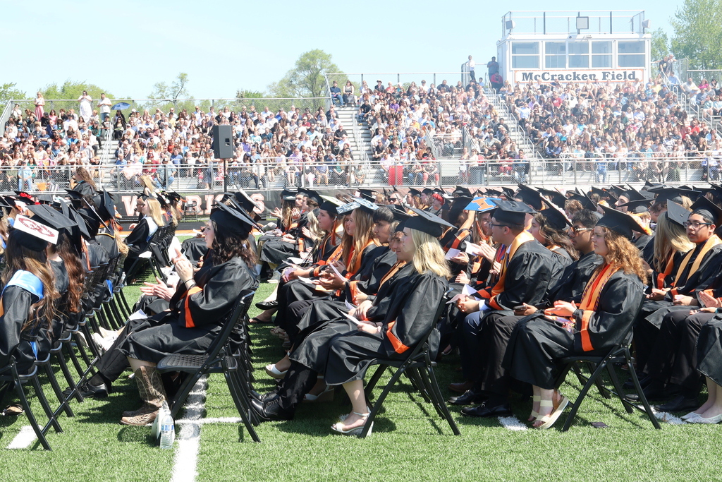 Students sitting at graduation