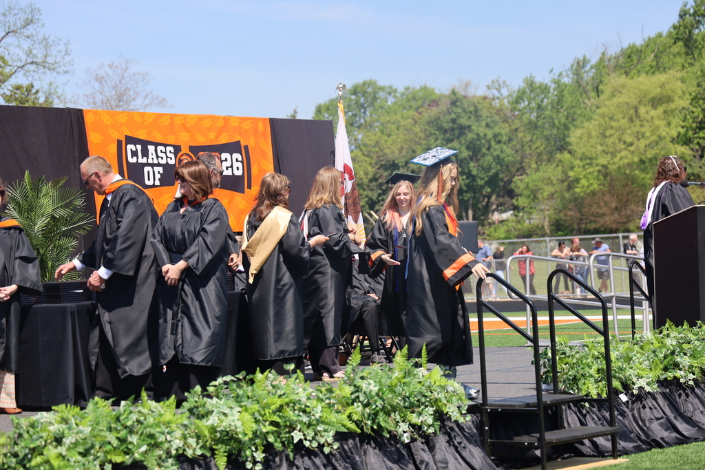 Students walking on the stage at graduation