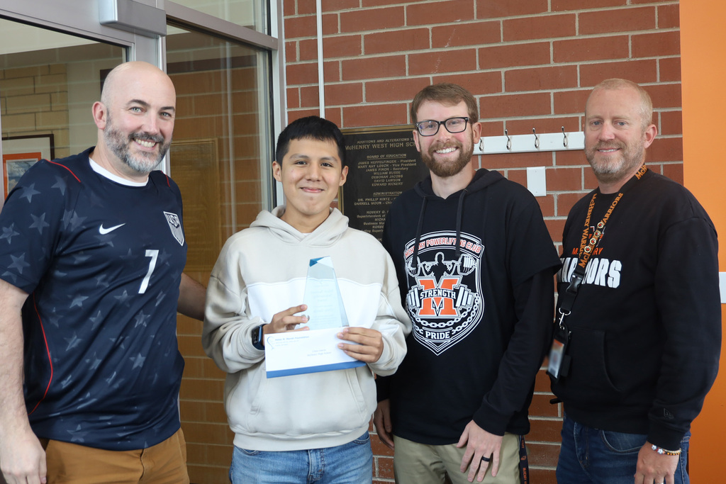 Jr Bocian, Chris holding his award, Mitch Stengel and Principal Eiserman