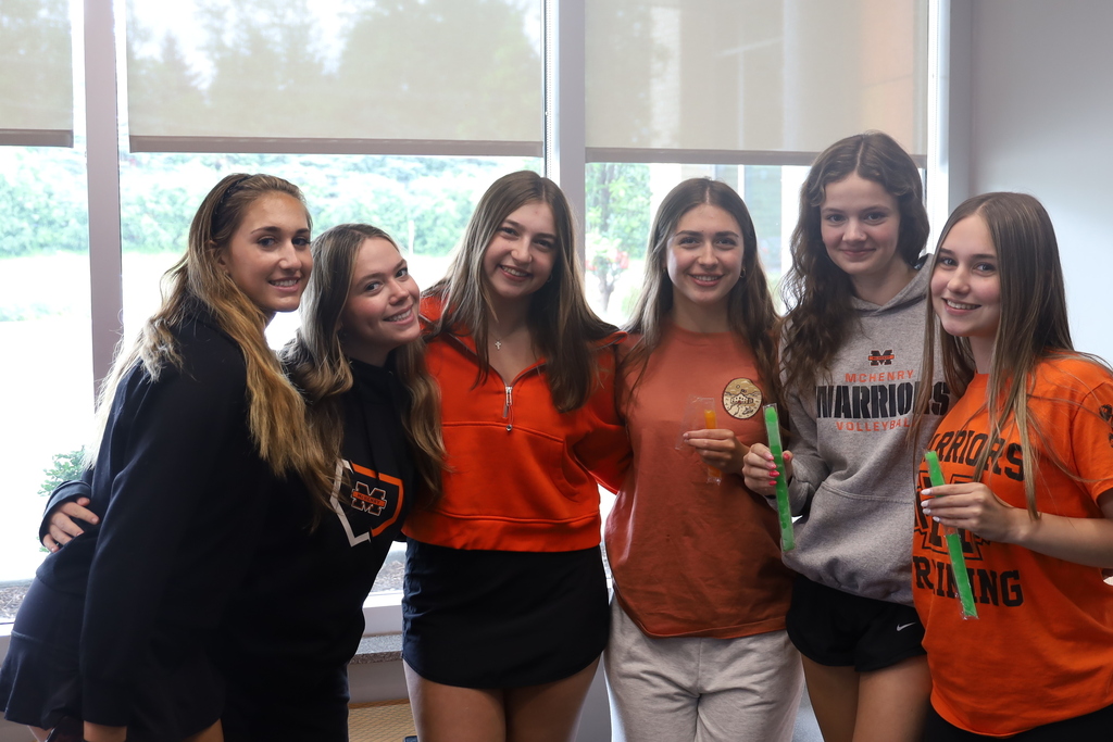 Five students, two of them holding freeze pops