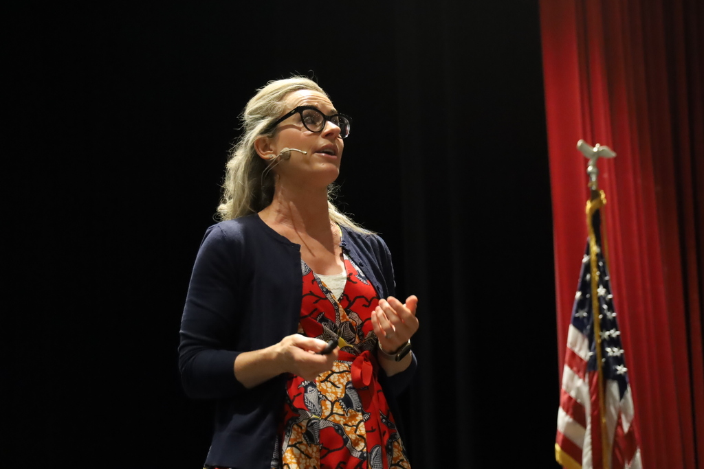 Catlin Tucker speaking on stage 