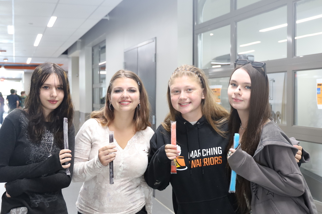 Four students with freeze pops